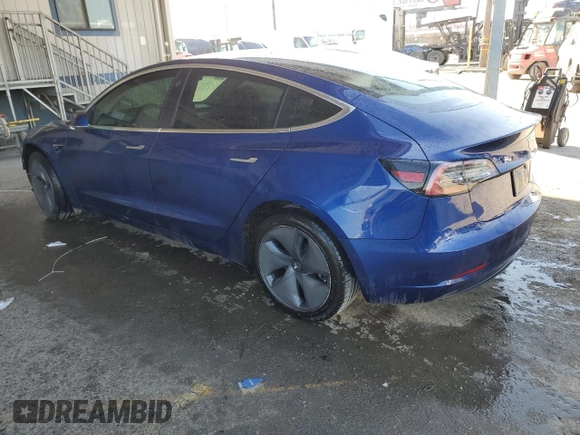 2020 Tesla Model 3 Standard Range Plus with VIN 5YJ3E1EA7LF705907, listed as a Copart auction lot 48765145 with 104,479 mi miles and Salvage Title. Bid and sale history available at DreamBid. Image 2.