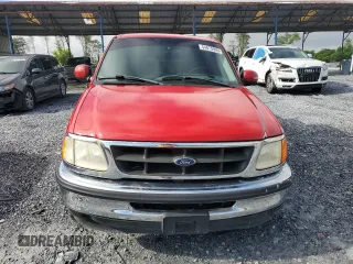 1998 Ford F-150 z VIN 1FTZX17W8WNC34501, wystawiony jako Copart lot #54675995 z przebiegiem 124 628 mil mil oraz Szkoda całkowita • Salvage title. Historia ofert i sprzedaży dostępna na DreamBid. Obrazek 5.