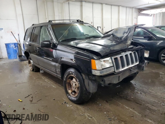 1996 Jeep Grand Cherokee Laredo with VIN 1J4GZ58S0TC402024, listed as a Copart auction lot 65074774 with 163,477 mi miles and Salvage Title. Bid and sale history available at carsss.com. Image 4.