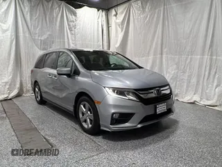 2018 Honda Odyssey EX-L z VIN 5FNRL6H71JB022823, wystawiony jako Copart lot #59892825 z przebiegiem 98 686 mil mil oraz Czysty tytuł • Clean title. Historia ofert i sprzedaży dostępna na DreamBid. Obrazek 1.