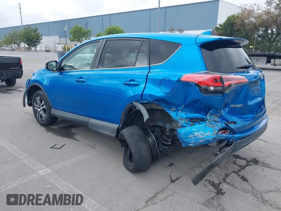 2018 Toyota RAV4 LE with VIN 2T3BFREV6JW740214, listed as a IAAI auction lot 42106349 with 105,831 mi miles and . Bid and sale history available at carsss.com. Image 3.