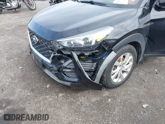 2019 Hyundai Tucson SE with VIN KM8J2CA46KU977863, listed as a IAAI auction lot 41704318 with 23,076 mi miles. Bid and sale history available at carsss.com. Image 18.