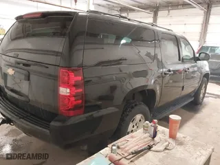 2013 Chevrolet Suburban LT with VIN 1GNSKJE75DR167705, listed as a IAAI auction lot 41521409 with 228,411 mi miles. Bid and sale history available at carsss.com. Image 4.