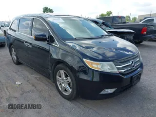 2011 Honda Odyssey Touring with VIN 5FNRL5H94BB003308, listed as a IAAI auction lot 42658707 with 178,687 mi miles and . Bid and sale history available at DreamBid. Image 1.