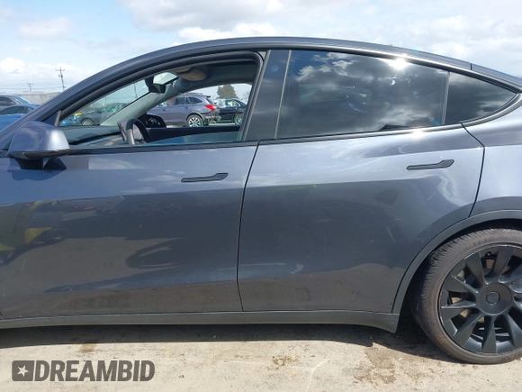 2022 Tesla Model Y Long Range with VIN 7SAYGAEE6NF341827, listed as a IAAI auction lot 41946388 with Not Provided miles and . Bid and sale history available at DreamBid. Image 13.