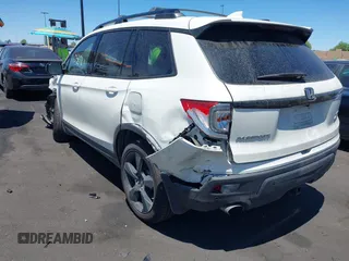 2019 Honda Passport Elite z VIN 5FNYF8H05KB009575, wystawiony jako IAAI lot #42804678 z przebiegiem 70 468 mil mil oraz . Historia ofert i sprzedaży dostępna na DreamBid. Obrazek 3.