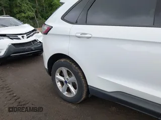 2015 Ford Edge SE z VIN 2FMTK4G87FBC18076, wystawiony jako IAAI lot #42536718 z przebiegiem 180 790 mil mil oraz . Historia ofert i sprzedaży dostępna na DreamBid. Obrazek 6.