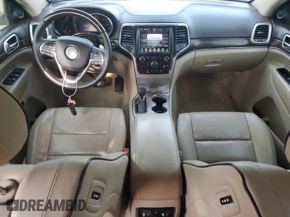 2016 Jeep Grand Cherokee Overland with VIN 1C4RJFCT2GC320247, listed as a Copart auction lot 50832195 with 104,300 mi miles and Salvage title. Bid and sale history available at DreamBid. Image 8.