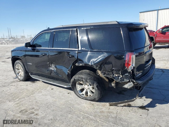 2016 GMC Yukon SLT with VIN 1GKS2BKC2GR251876, listed as a Copart auction lot 77204944 with 111,099 mi miles and Salvage Title. Bid and sale history available at carsss.com. Image 2.