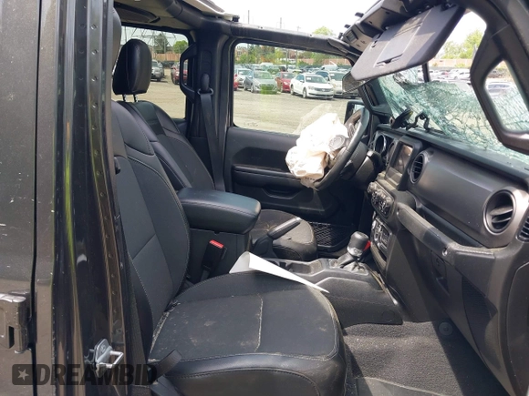 2021 Jeep Gladiator Freedom with VIN 1C6HJTAG3ML557932, listed as a IAAI auction lot 42150245 with 26,656 mi miles and . Bid and sale history available at DreamBid. Image 5.