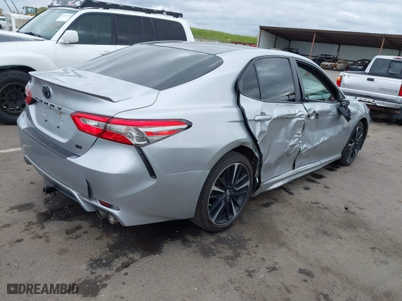 2018 Toyota Camry LE with VIN 4T1B11HK0JU129623, listed as a IAAI auction lot 41902335 with 100,643 mi miles. Bid and sale history available at carsss.com. Image 4.