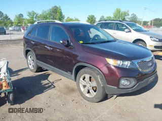 2012 Kia Sorento EX with VIN 5XYKUDA23CG206609, listed as a IAAI auction lot 42142072 with 162,574 mi miles. Bid and sale history available at carsss.com. Image 1.