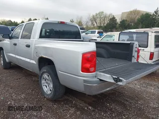 2005 Dodge Dakota SLT with VIN 1D7HE48K25S232893, listed as a IAAI auction lot 41932773 with 209,459 mi miles and . Bid and sale history available at DreamBid. Image 3.