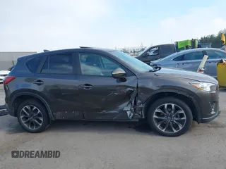 2016 Mazda CX-5 Grand Touring z VIN JM3KE4DY2G0684066, wystawiony jako IAAI lot #42078725 z przebiegiem 200 129 mil mil oraz . Historia ofert i sprzedaży dostępna na DreamBid. Obrazek 13.