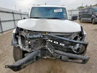2024 Ford Bronco Wildtrak z VIN 1FMEE2BP4RLA19493, wystawiony jako Copart lot #57669545 z przebiegiem 12 065 mil mil oraz Szkoda całkowita • Salvage title. Historia ofert i sprzedaży dostępna na DreamBid. Obrazek 5.