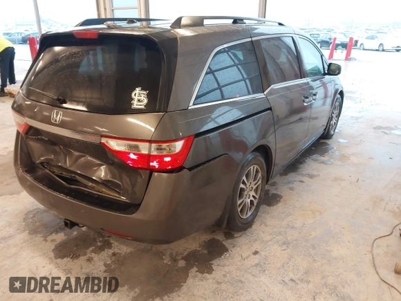2012 Honda Odyssey EX-L with VIN 5FNRL5H66CB127507, listed as a IAAI auction lot 41961465 with 228,972 mi miles and . Bid and sale history available at carsss.com. Image 4.