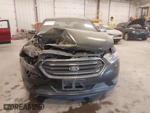 2014 Ford Taurus Limited z VIN 1FAHP2J88EG112614, wystawiony jako IAAI lot #42135220 z przebiegiem 70 409 mil mil oraz . Historia ofert i sprzedaży dostępna na DreamBid. Obrazek 12.