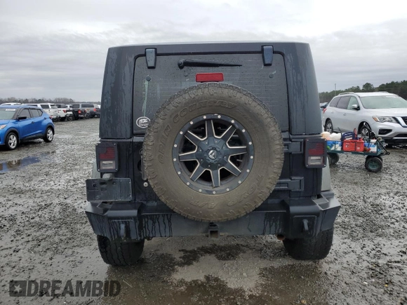2009 Jeep Wrangler X with VIN 1J4FA241X9L735743, listed as a Copart auction lot 48109455 with 232,110 mi miles and Salvage Title. Bid and sale history available at DreamBid. Image 6.