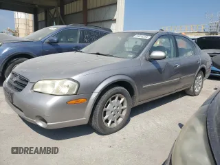 2001 Nissan Maxima GXE z VIN JN1CA31D71T601812, wystawiony jako Copart lot #69035284 z przebiegiem 294 299 mil mil oraz Szkoda całkowita • Salvage title. Historia ofert i sprzedaży dostępna na DreamBid. Obrazek 1.