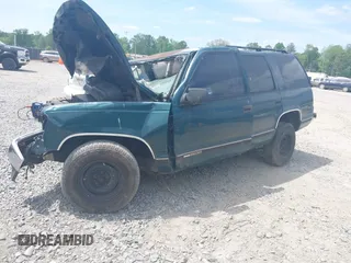1996 GMC Yukon with VIN 1GKEC13R7TJ704518, listed as a IAAI auction lot 42095936 with 1 mi miles. Bid and sale history available at carsss.com. Image 2.