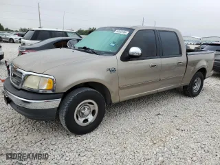 2001 Ford F-150 SuperCrew XLT with VIN 1FTRW07L21KF72022, listed as a Copart auction lot 69532204 with 205,793 mi miles and Salvage Title. Bid and sale history available at carsss.com. Image 1.
