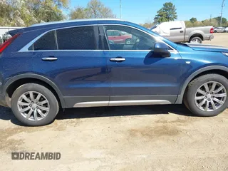 2019 Cadillac XT4 FWD Premium Luxury z VIN 1GYFZCR47KF109394, wystawiony jako IAAI lot #41864606 z przebiegiem 98 425 mil mil oraz . Historia ofert i sprzedaży dostępna na DreamBid. Obrazek 13.