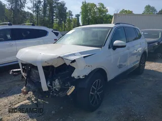2021 Volkswagen Tiguan SE with VIN 3VV3B7AX7MM080266, listed as a IAAI auction lot 42062147 with 66,786 mi miles and . Bid and sale history available at DreamBid. Image 16.