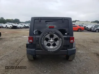 2018 Jeep Wrangler JK Unlimited Sahara with VIN 1C4HJWEG7JL909023, listed as a Copart auction lot 72774404 with 106,801 mi miles and Salvage Title. Bid and sale history available at carsss.com. Image 6.