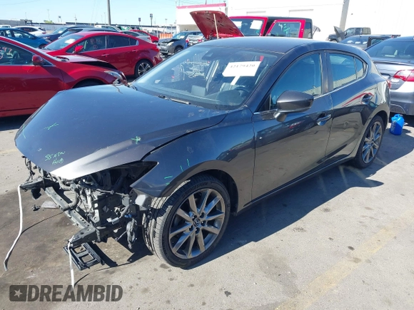 2018 Mazda 3 Touring with VIN 3MZBN1L34JM164952, listed as a IAAI auction lot 42179420 with 106,706 mi miles and . Bid and sale history available at DreamBid. Image 17.