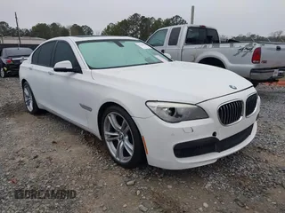2014 BMW 7 Series 740i with VIN WBAYA6C51ED144387, listed as a IAAI auction lot 41226638 with 161,448 mi miles. Bid and sale history available at carsss.com. Image 1.