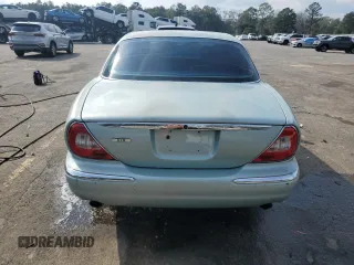 2004 Jaguar XJ with VIN SAJWA71C94SG24466, listed as a Copart auction lot 46610995 with 173,570 mi miles and Salvage Title. Bid and sale history available at carsss.com. Image 6.