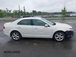 2012 Ford Fusion SE z VIN 3FAHP0HA4CR261668, wystawiony jako IAAI lot #42318115 z przebiegiem 81 923 mil mil oraz . Historia ofert i sprzedaży dostępna na DreamBid. Obrazek 13.