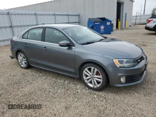 2014 Volkswagen Jetta GLI z VIN 3VW4T7AJ2EM245201, wystawiony jako Copart lot #64901935 z przebiegiem 147 799 mil mil oraz Czysty tytuł • Clean title. Historia ofert i sprzedaży dostępna na DreamBid. Obrazek 4.