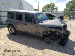 2022 Jeep Wrangler Unlimited Sahara Altitude with VIN 1C4HJXEG4NW248402, listed as a Copart auction lot 63052465 with 36,732 mi miles and Salvage title. Bid and sale history available at DreamBid. Image 4.