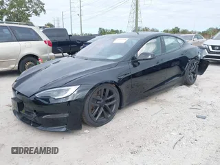 2023 Tesla Model S with VIN 5YJSA1E52PF500088, listed as a IAAI auction lot 41372918 with Not provided miles and . Bid and sale history available at DreamBid. Image 2.