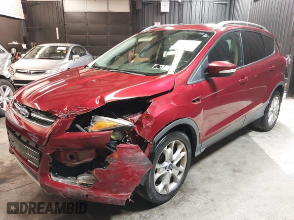 2014 Ford Escape Titanium with VIN 1FMCU9J9XEUD69589, listed as a IAAI auction lot 42031882 with 123,632 mi miles and . Bid and sale history available at DreamBid. Image 2.