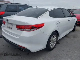 2016 Kia Optima LX with VIN 5XXGT4L32GG047624, listed as a IAAI auction lot 42068219 with 114,316 mi miles. Bid and sale history available at carsss.com. Image 4.