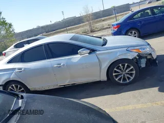 2015 Hyundai Azera z VIN KMHFG4JG0FA453994, wystawiony jako IAAI lot #42002922 z przebiegiem 102 094 mil mil oraz . Historia ofert i sprzedaży dostępna na DreamBid. Obrazek 13.