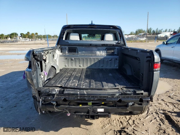 2022 Rivian R1T Adventure Package with VIN 7FCTGAAA6NN013037, listed as a Copart auction lot 75548964 with 8,877 mi miles and Salvage Title. Bid and sale history available at carsss.com. Image 6.