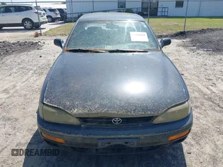 1995 Toyota Camry LE z VIN 4T1SK12E3SU576500, wystawiony jako IAAI lot #42186816 z przebiegiem 216 809 mil mil oraz . Historia ofert i sprzedaży dostępna na DreamBid. Obrazek 6.
