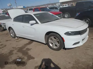 2021 Dodge Charger SXT with VIN 2C3CDXBG5MH605867, listed as a IAAI auction lot 41682336 with 56,660 mi miles and . Bid and sale history available at DreamBid. Image 1.