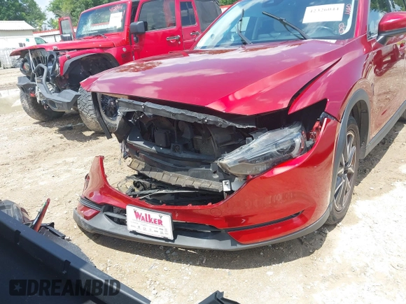 2018 Mazda CX-5 Grand Touring with VIN JM3KFADM4J0335913, listed as a IAAI auction lot 42326044 with 104,583 mi miles and . Bid and sale history available at DreamBid. Image 6.