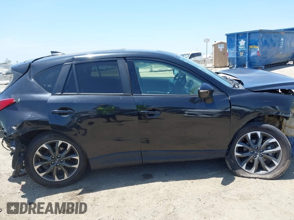 2016 Mazda CX-5 Grand Touring z VIN JM3KE2DY6G0900005, wystawiony jako IAAI lot #42311162 z przebiegiem 80 758 mil mil oraz . Historia ofert i sprzedaży dostępna na DreamBid. Obrazek 14.