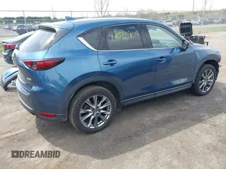 2019 Mazda CX-5 Signature with VIN JM3KFBEY1K0512880, listed as a IAAI auction lot 42036904 with 92,650 mi miles. Bid and sale history available at carsss.com. Image 4.
