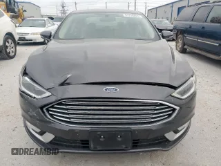 2017 Ford Fusion Hybrid Titanium with VIN 3FA6P0RU7HR388521, listed as a Copart auction lot 57318895 with 117,720 mi miles and Salvage title. Bid and sale history available at DreamBid. Image 5.