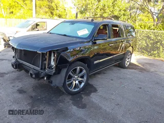 2015 Cadillac Escalade ESV Premium z VIN 1GYS4JKJXFR291842, wystawiony jako IAAI lot #41235490 z przebiegiem 115 037 mil mil oraz . Historia ofert i sprzedaży dostępna na DreamBid. Obrazek 2.