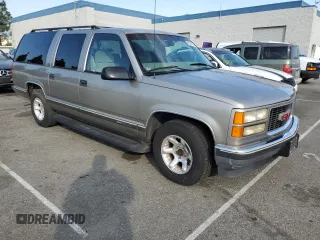 1999 GMC Suburban with VIN 3GKEC16R0XG526194, listed as a Copart auction lot 83740634 with 199,583 mi miles and Clean title. Bid and sale history available at DreamBid. Image 4.
