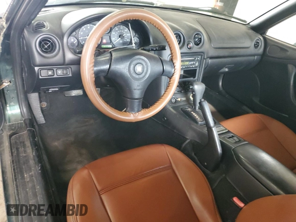 1999 Mazda MX-5 Miata z VIN JM1NB353XX0111850, wystawiony jako Copart lot #53076805 z przebiegiem 128 707 mil mil oraz Szkoda całkowita • Salvage title. Historia ofert i sprzedaży dostępna na DreamBid. Obrazek 8.