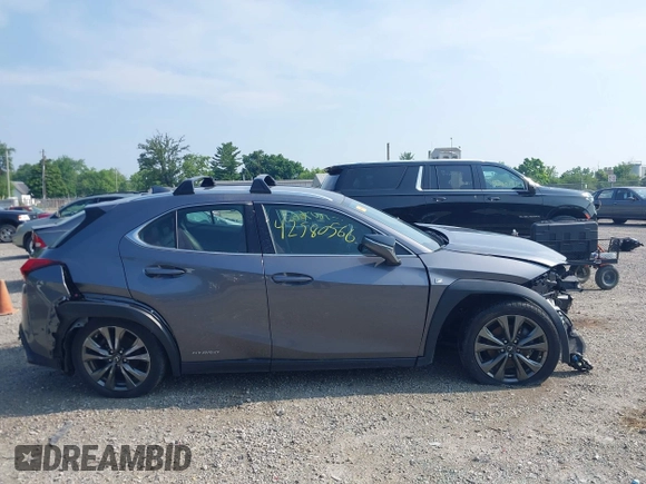 2021 Lexus UX 250h F Sport z VIN JTHE9JBHXM2045377, wystawiony jako IAAI lot #42580566 z przebiegiem 52 838 mil mil oraz . Historia ofert i sprzedaży dostępna na DreamBid. Obrazek 14.