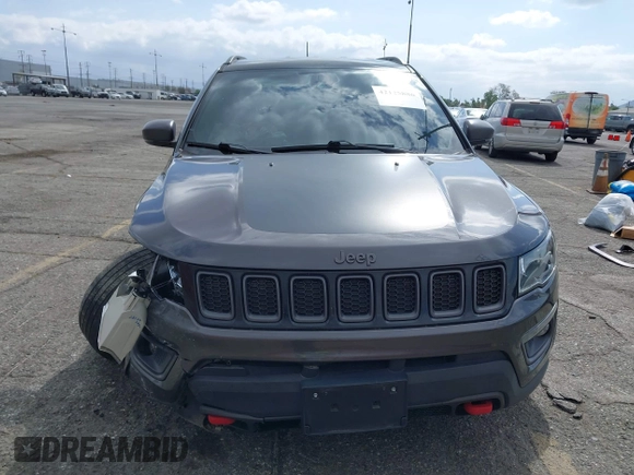 2021 Jeep Compass Trailhawk with VIN 3C4NJDDB6MT561074, listed as a IAAI auction lot 42125886 with 77,293 mi miles and . Bid and sale history available at DreamBid. Image 6.